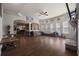 Open living area with hardwood floors and abundant natural light, flowing into kitchen at 1617 Matt Springs Dr, Lawrenceville, GA 30045