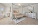 Spacious main bedroom featuring a luxurious four-poster bed and matching furniture set at 1617 Matt Springs Dr, Lawrenceville, GA 30045