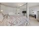 Bright main bedroom with a decorative bed and an entryway to a comfy living space at 1617 Matt Springs Dr, Lawrenceville, GA 30045