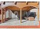 Backyard patio featuring a stone base, wooden roof, and a white door, providing a shady space at 1617 Matt Springs Dr, Lawrenceville, GA 30045
