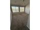 Bedroom with plush carpeting and two large windows offering natural light at 2372 Johnson Rd, Atlanta, GA 30345