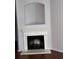 Bright living room with a fireplace and a decorative mantle, complemented by sleek wooden floors at 2372 Johnson Rd, Atlanta, GA 30345