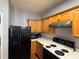 Well-equipped kitchen featuring wooden cabinets, white countertops, and modern appliances at 2372 Johnson Rd, Atlanta, GA 30345