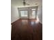 Open-concept living room with modern wood-look flooring and ample natural light coming through the windows at 2372 Johnson Rd, Atlanta, GA 30345