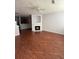 Spacious living area with fireplace, wood floors and view of the kitchen with breakfast bar at 2372 Johnson Rd, Atlanta, GA 30345
