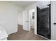 Modern bathroom with gray tiled shower and wood-look flooring at 53 Carrington Lndg, Douglasville, GA 30134