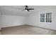 Vaulted ceiling bedroom with modern ceiling fan and large window at 53 Carrington Lndg, Douglasville, GA 30134