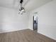 Elegant dining room features modern lighting and wood-look floors, open to the kitchen at 53 Carrington Lndg, Douglasville, GA 30134