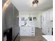 Modern kitchen features white cabinets, quartz countertops, and stainless steel appliances at 53 Carrington Lndg, Douglasville, GA 30134