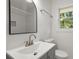 Updated bathroom with vanity, mirror, and natural light at 5539 Andrew Sw Dr, Mableton, GA 30126