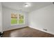 Bright bedroom with hardwood floors and large windows at 5539 Andrew Sw Dr, Mableton, GA 30126