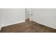 Bedroom with hardwood floors, white trim and open door at 5539 Andrew Sw Dr, Mableton, GA 30126