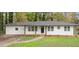 Charming single-story home featuring a modern exterior and well-maintained front yard at 5539 Andrew Sw Dr, Mableton, GA 30126