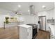 Modern kitchen features stainless steel appliances and a central island with gas cooktop at 5539 Andrew Sw Dr, Mableton, GA 30126