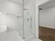 Glass enclosed shower with rain shower head and modern fixtures at 5539 Andrew Sw Dr, Mableton, GA 30126