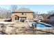 Inviting backyard with sparkling pool, patio area, and well-maintained lawn at 8340 Nolandwood Ln, Villa Rica, GA 30180