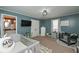 Charming bedroom with blue walls, two cribs and a connecting bathroom at 8340 Nolandwood Ln, Villa Rica, GA 30180