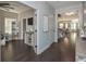 Open foyer featuring dark hardwood floors and a view into multiple rooms, creating a welcoming atmosphere at 8340 Nolandwood Ln, Villa Rica, GA 30180