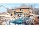 Inviting backyard pool with lounge chairs, hot tub, and outdoor seating area at 8340 Nolandwood Ln, Villa Rica, GA 30180