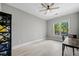 Bright bedroom with wood-look floors, large window, and a modern ceiling fan with lighting at 11 Perimeter E Ctr # 1115, Atlanta, GA 30346