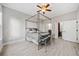 Bright bedroom featuring a canopy bed, ceiling fan, closet and an ensuite bathroom at 11 Perimeter E Ctr # 1115, Atlanta, GA 30346