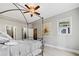 Bedroom featuring a decorative metal bed, a ceiling fan, and modern accents at 11 Perimeter E Ctr # 1115, Atlanta, GA 30346