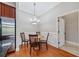 Dining area featuring modern lighting, wood floors, and white wainscoting and trim at 11 Perimeter E Ctr # 1115, Atlanta, GA 30346