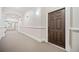 Hallway leading to unit entrance, with neutral carpet and classic design at 11 Perimeter E Ctr # 1115, Atlanta, GA 30346