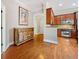 View of the kitchen and a decorative console with hardwood floors and stainless steel appliances at 11 Perimeter E Ctr # 1115, Atlanta, GA 30346