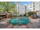 Community pool area with a covered pool at 11 Perimeter E Ctr # 1115, Atlanta, GA 30346