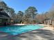 Expansive community pool area with ample deck space for lounging and relaxation by the pool at 1401 Riverview Se Dr # 1401, Marietta, GA 30067