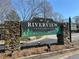 Welcome to Riverview Condominiums sign surrounded by stacked stone and manicured landscaping at 1401 Riverview Se Dr # 1401, Marietta, GA 30067