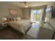 Cozy main bedroom with natural light and a sliding door to the balcony at 1401 Riverview Se Dr # 1401, Marietta, GA 30067