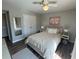 This main bedroom boasts a large closet, neutral paint and carpet, and a modern ceiling fan at 1401 Riverview Se Dr # 1401, Marietta, GA 30067