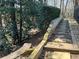 Landscaped stone pathway with wooden accents leading through lush greenery at 1401 Riverview Se Dr # 1401, Marietta, GA 30067