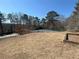 Scenic view of community tennis courts and pool surrounded by lush greenery and trees at 1401 Riverview Se Dr # 1401, Marietta, GA 30067