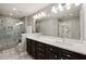 Elegant bathroom featuring double vanity, stylish lighting, and a large glass-enclosed walk-in shower at 3930 Covey Flush Sw Ct # 21, Smyrna, GA 30082