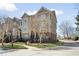 Attractive townhome exterior with manicured landscaping, brick accents, and a welcoming entryway in a sunny setting at 3930 Covey Flush Sw Ct # 21, Smyrna, GA 30082