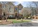 Inviting townhome with well-maintained landscaping, brick accents, and a welcoming front entrance and mature trees at 3930 Covey Flush Sw Ct # 21, Smyrna, GA 30082