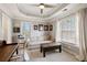 Sunlit sitting room featuring neutral decor, a ceiling fan and two bright windows at 3930 Covey Flush Sw Ct # 21, Smyrna, GA 30082