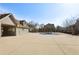 Community pool with pool house building in the background and barren trees at 5227 Whiteoak Se Ave, Smyrna, GA 30080