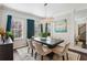 Elegant dining room featuring a modern chandelier, dark wood table, and stylish decor at 5227 Whiteoak Se Ave, Smyrna, GA 30080