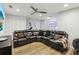 Recessed lights brighten this basement space with sectional and wood-look vinyl floors at 5227 Whiteoak Se Ave, Smyrna, GA 30080