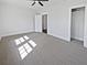 Spacious bedroom with closet and new neutral carpet at 6120 E Fayetteville Dr, Riverdale, GA 30296