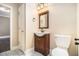 Bathroom featuring a vanity, toilet, tile flooring, and neutral paint at 9610 Cedar Grove Rd, Fairburn, GA 30213