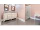 Bathroom boasts a marble vanity and glass shower at 9610 Cedar Grove Rd, Fairburn, GA 30213