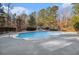 Backyard pool with slide in a fenced in yard at 9610 Cedar Grove Rd, Fairburn, GA 30213