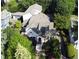Charming home with well-manicured yard, stone chimney, and detached garage surrounded by mature trees at 1666 Johnson Ne Rd, Atlanta, GA 30306