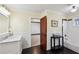 Well-lit bathroom showcasing a tiled tub/shower, stylish fixtures, and beadboard accents at 1666 Johnson Ne Rd, Atlanta, GA 30306