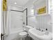 Bright bathroom with white subway tiles, beadboard, and classic fixtures at 1666 Johnson Ne Rd, Atlanta, GA 30306